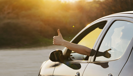 thumbs up out the car window